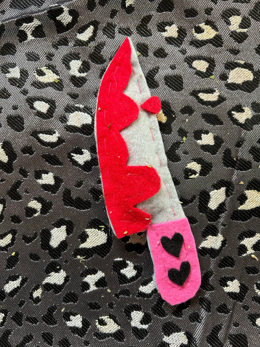 A Valentine's Day knife catnip cat toy