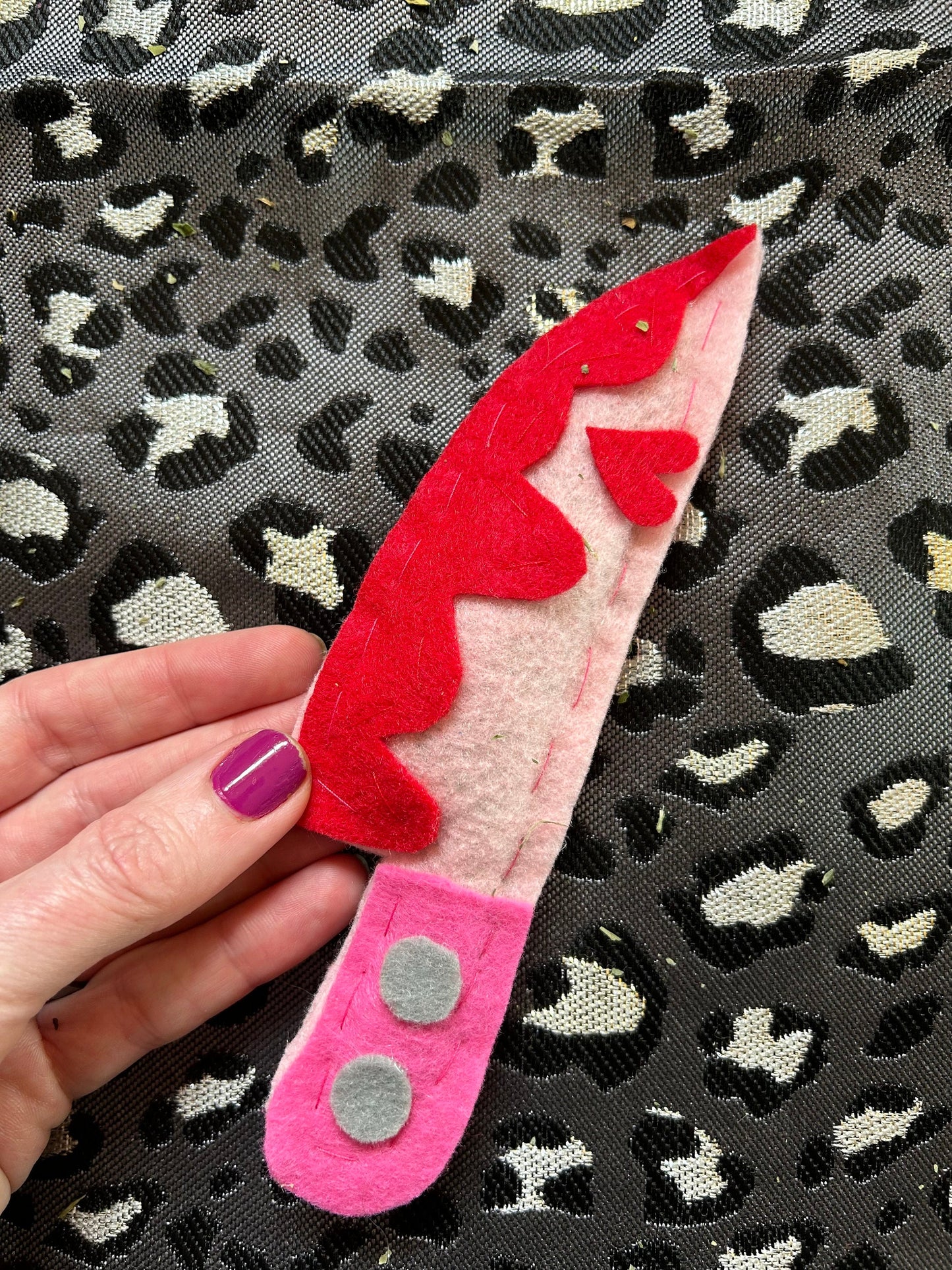A Valentine's Day knife catnip cat toy